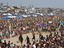 Volleyball games and crowds of spectators at the Manhattan Beach Surf Festival Volleyball Tournament.