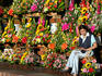 Young woman at her outdoor florist shop.