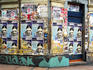 Bill posters on city wall.