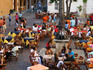 Busy Plaza de Santa Domingo during peak season in the walled city.