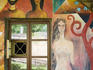 Detail of building located along the Vilnia River in the Uzupis Republic painted with a colorful mural.