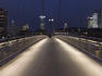 Holbeinsteg pedestrian bridge over River Main at night.
