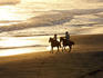 Couple horse-riding on Playa Los Destiladeros (beach).