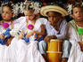 Children wearing Pollera national dress at La Mejorana music festival.