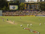 Test cricket match at the Adelaide Oval with the heritage scoreboard in background.