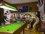 Enjoying a game of pool in bar of Hampshire Hotel.