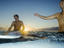 Surfers playing in the water, Playa Carmen.