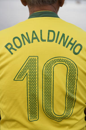 Back view of man wearing number 10 Ronaldinho Brazilian national soccer team football jersey.