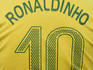 Back view of man wearing number 10 Ronaldinho Brazilian national soccer team football jersey.