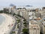 Overhead view of Copacabana beach and high-rise buildings.