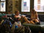 Backpackers relax in the lounge at Base ACB.