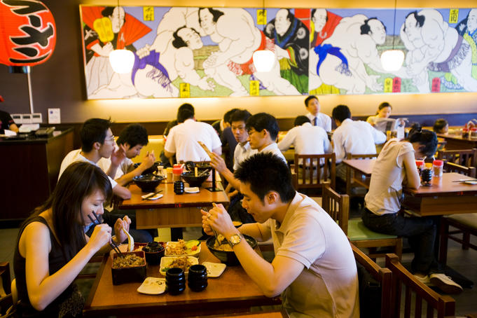 Diners at Ajisen, a popular Japanese food cafe, French Concession.