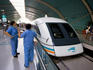 Workers cleaning the high-speed Maglev train before another journey to Pudong airport.