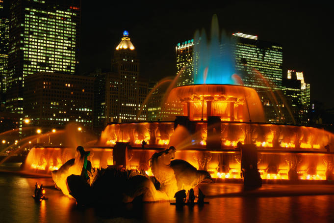 The Buckingham Fountain in Grant Park on Michigan Avenue, under lights at night - Chicago, Illinois