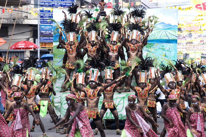 Dance group performing at Dinagyang Festival street parade.