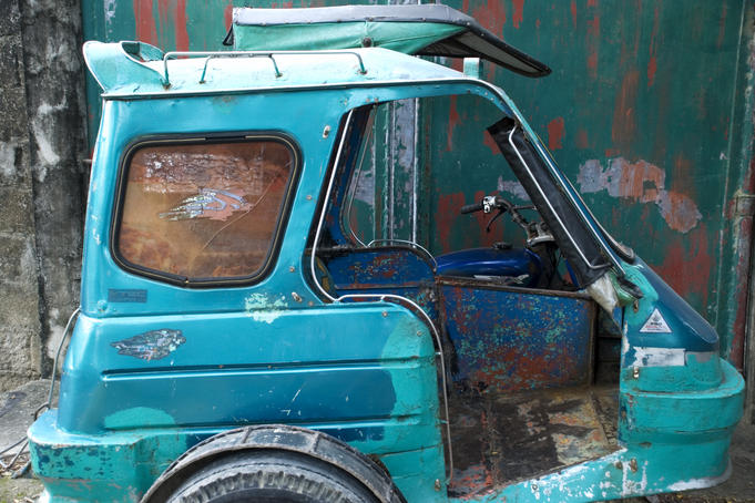 Abandoned motor tricycle.