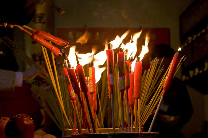Burning incense sticks at Man Mo Temple.