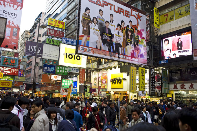 Crowded street in shopping area.