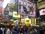 Crowded street in shopping area.