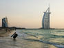 Dubai beach with Burj al-Arab hotel (right), standing on an artificial island out from Jumeirah beach, in background.