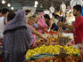 Vendors selling fresh produce, Queen Victoria Market.