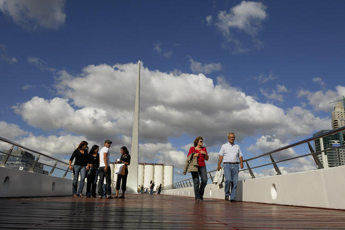 People walking across the Puente de la Mujer (Woman's Bridge), Buenos Aires