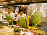 Serving a noodle lunch at Tsim Chai Kee restaurant.