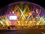 Space-age dome of Casino Grand Lisboa at night.