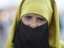 Portrait of elderly woman in traditional dress.