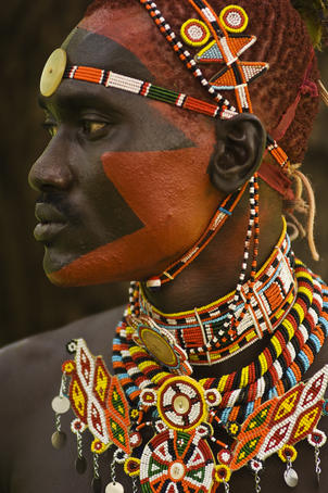 Side profile of highly decorated Samburu Warrior.