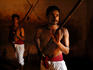 Two men practising the martial art of Kalari at the Ayurveda Mana, Peringode.