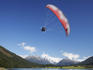 Paramotor soaring over Diamond Lake, Queenstown region.