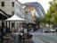 Outdoor dining at The Rocks Cafe, 99 George Street, The Rocks, with Sydney Harbour Bridge in background.
