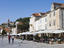 Outdoor seating at cafes on town square.