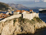 Old Town city wall, with sailing cruiseship Royal Clipper and cruiseship Costa Serena.