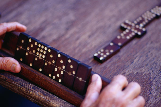 Playing dominoes, a tile game