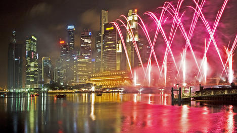City buildings and fireworks celebrating Chinese New Year.