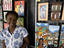 Local artist from Rocinha with her paintings.
