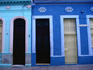 Doors in the colourful blue buildings of Santa Clara near the city centre