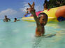 Boy giving the v sign while playing in Boracay's waters.