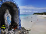 Icon in an enclosed stone shrine looking out over White Beach.