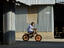 Child on bicycle, Thailand