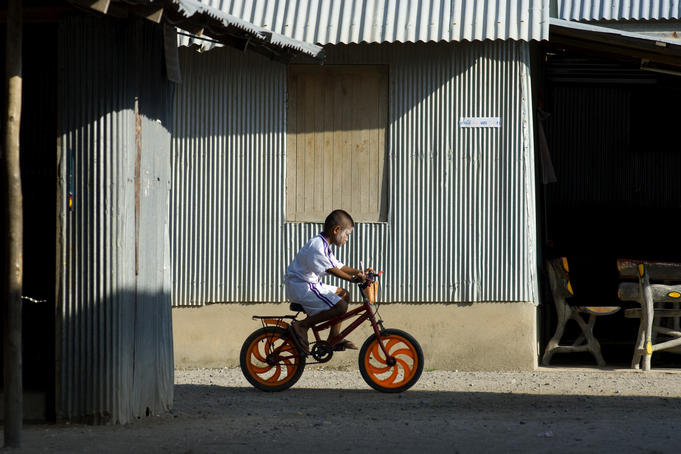 Child on bicycle, Ko Sireh.