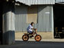 Child on bicycle, Ko Sireh.