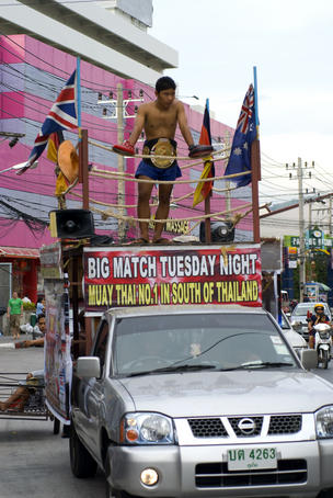 Advertising Thai boxing match.