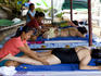 Tourist having massage on Laem Singh Beach.