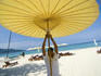 Man putting up umbrella on Kamala Beach.
