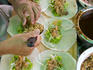 Vendor making Phuket-style spring rolls.