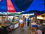 Tourists near food stalls at Hat Lamai evening market.