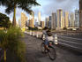 Paitilla Point and Balboa Avenue in rush hour, a cyclist on the walkway.